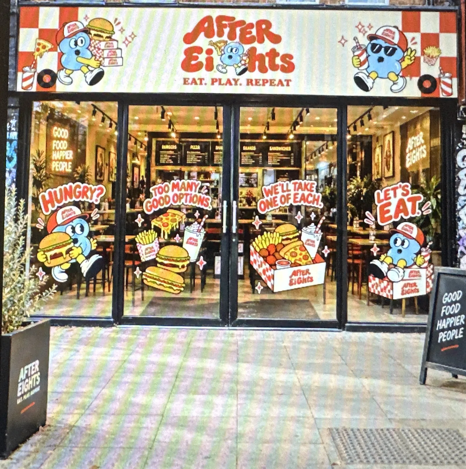 Shopfront dressed in the brand, with red and white checkerboard trim and window graphics