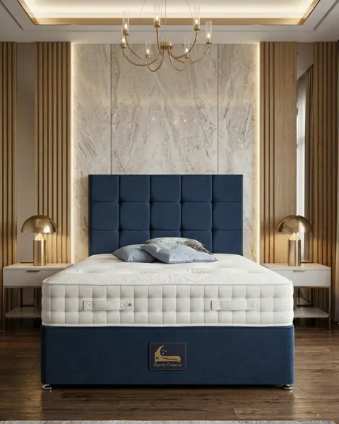 Navy blue tufted headboard divan bed in a marble-accented bedroom